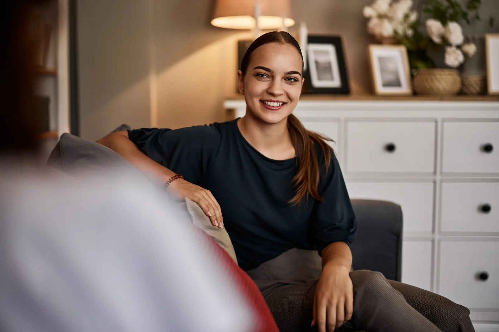 A woman smiling, hopeful and at peace